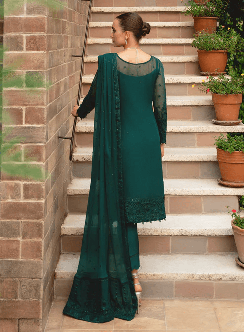 Model wearing Gulaal ELYSIA embroidered green dress, luxe Pakistani clothes UK