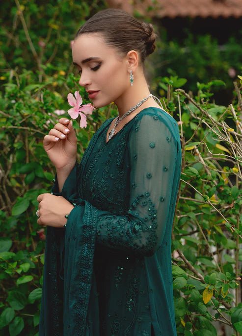 Model wearing Gulaal ELYSIA embroidered green dress, luxe Pakistani clothes UK