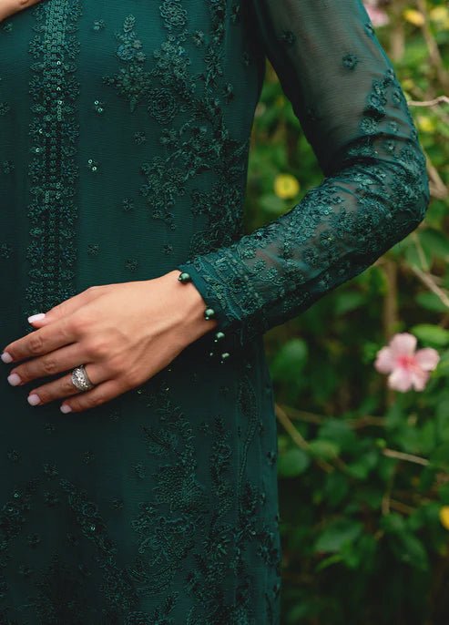 Model wearing Gulaal ELYSIA embroidered green dress, luxe Pakistani clothes UK