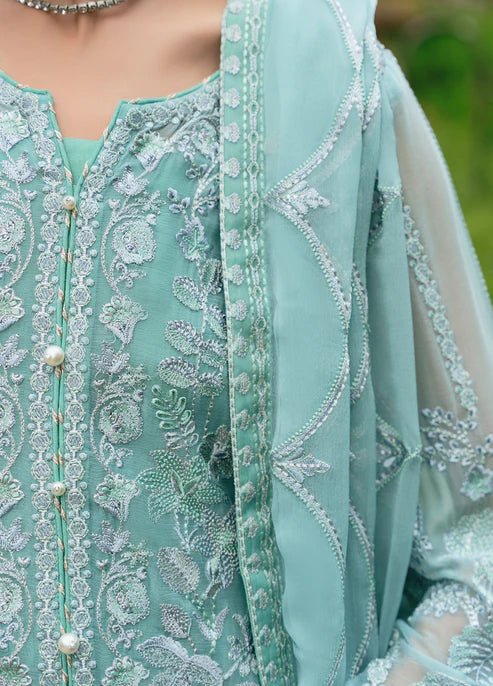 Model wearing Gulaal NISSA dress, sea green Pakistani fashion UK.