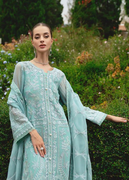 Model wearing Gulaal NISSA dress, sea green Pakistani fashion UK.