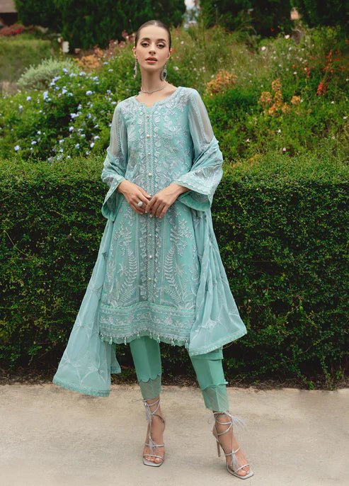 Model wearing Gulaal NISSA dress, sea green Pakistani fashion UK.