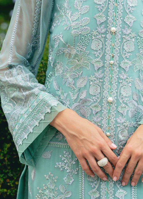 Model wearing Gulaal NISSA dress, sea green Pakistani fashion UK.