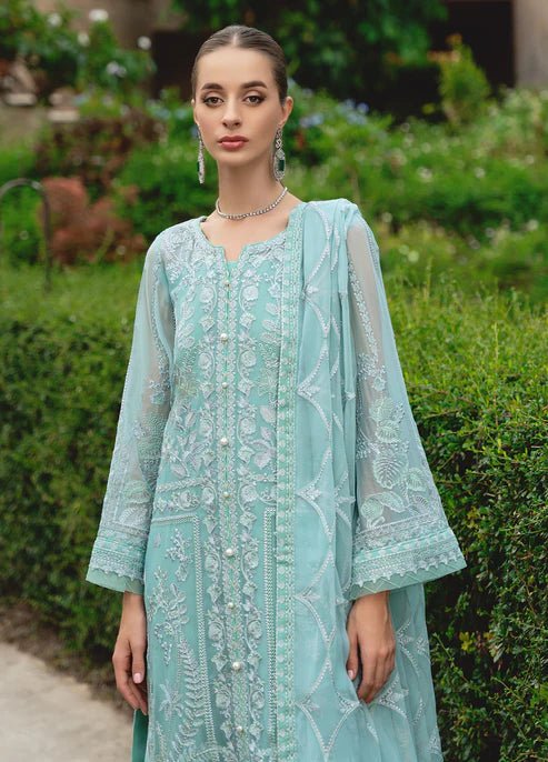 Model wearing Gulaal NISSA dress, sea green Pakistani fashion UK.