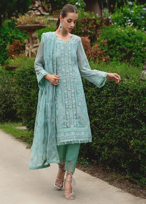 Model wearing Gulaal NISSA dress, sea green Pakistani fashion UK.