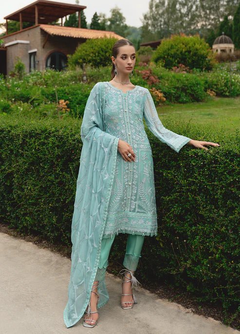 Model wearing Gulaal NISSA dress, sea green Pakistani fashion UK.