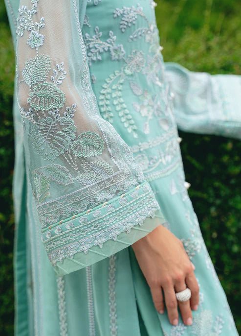 Model wearing Gulaal NISSA dress, sea green Pakistani fashion UK.