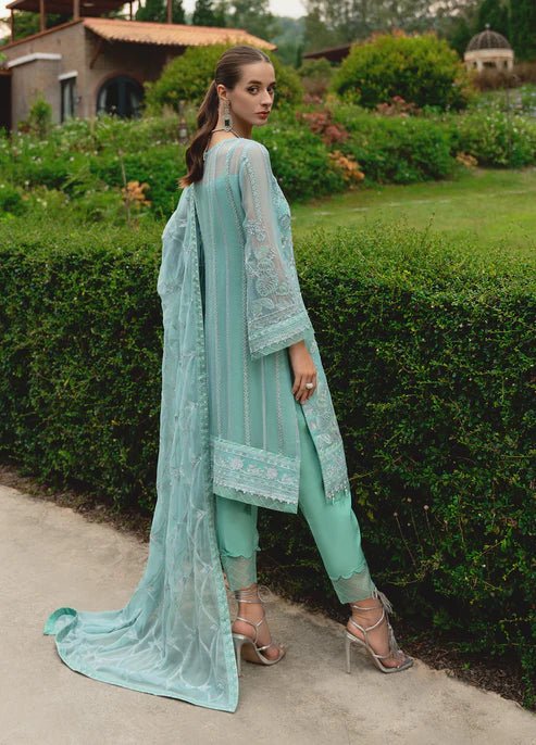 Model wearing Gulaal NISSA dress, sea green Pakistani fashion UK.