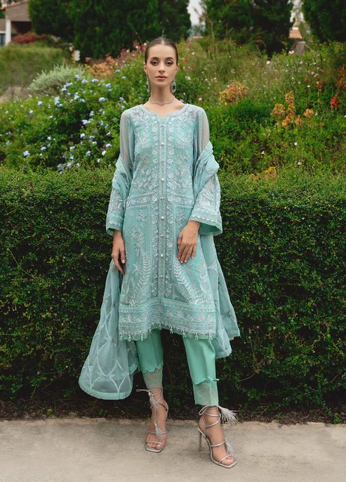 Model wearing Gulaal NISSA dress, sea green Pakistani fashion UK.