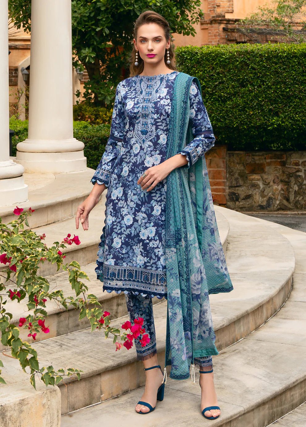 Model in Gulaal OLVERA, floral Pakistani attire, UK fashion must - have.