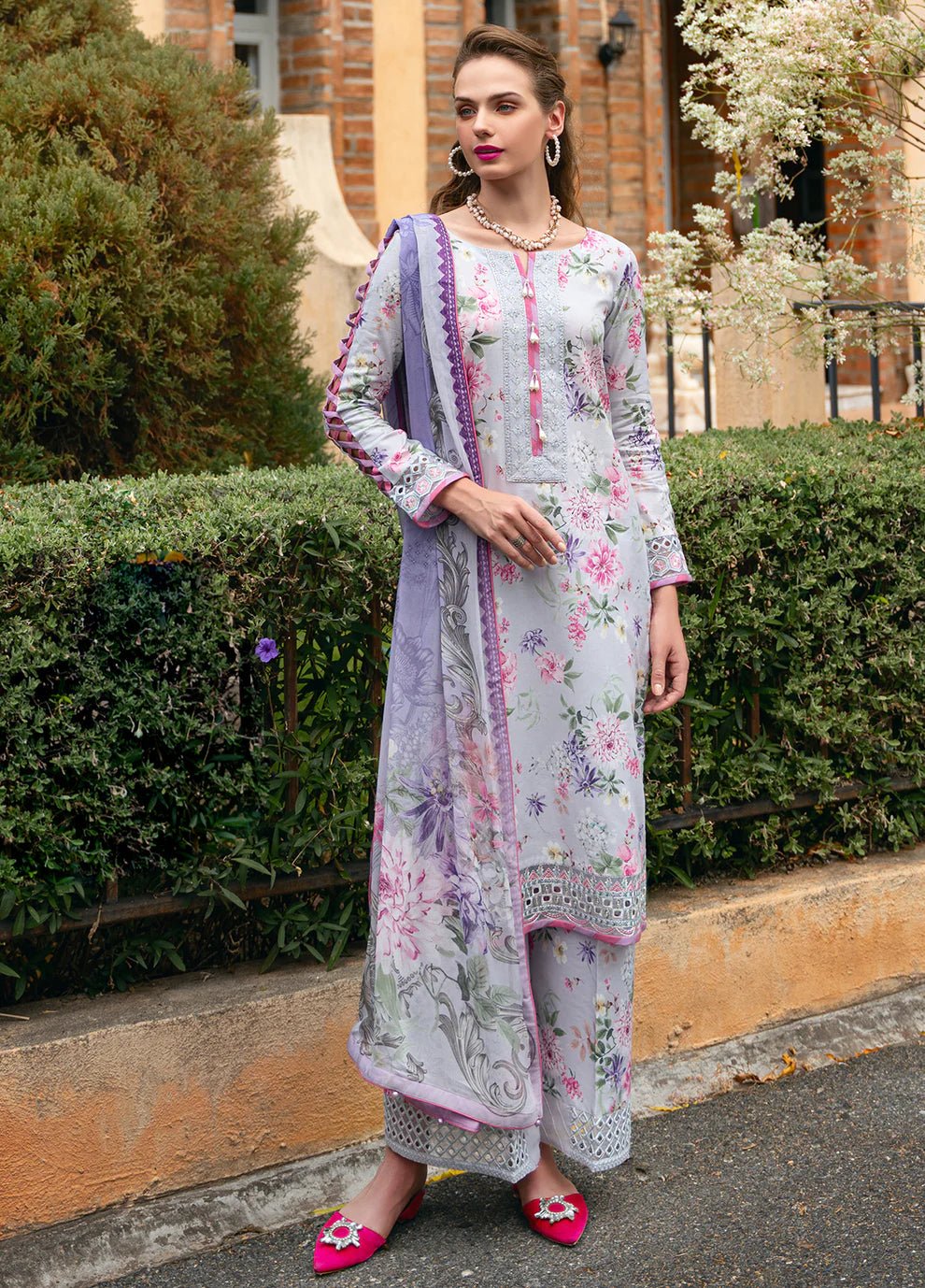 Model in Gulaal VIOLETTE, soft floral print Pakistani suit, UK collection.