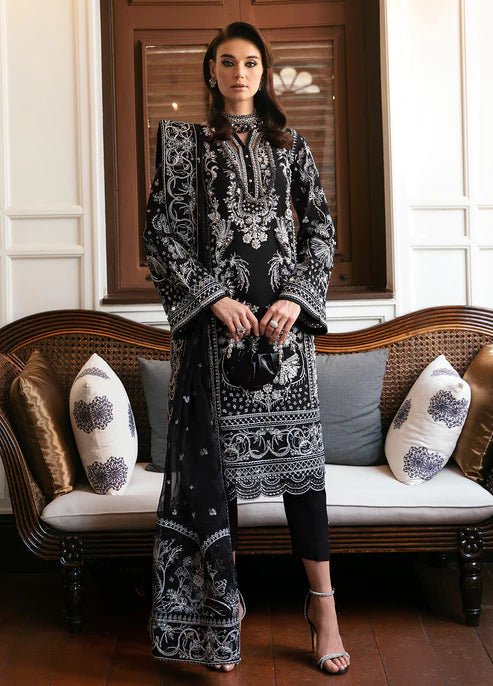 Model wearing the NADINE black and white dress from Gulaal, showcasing luxurious Pakistani clothes online in the UK.