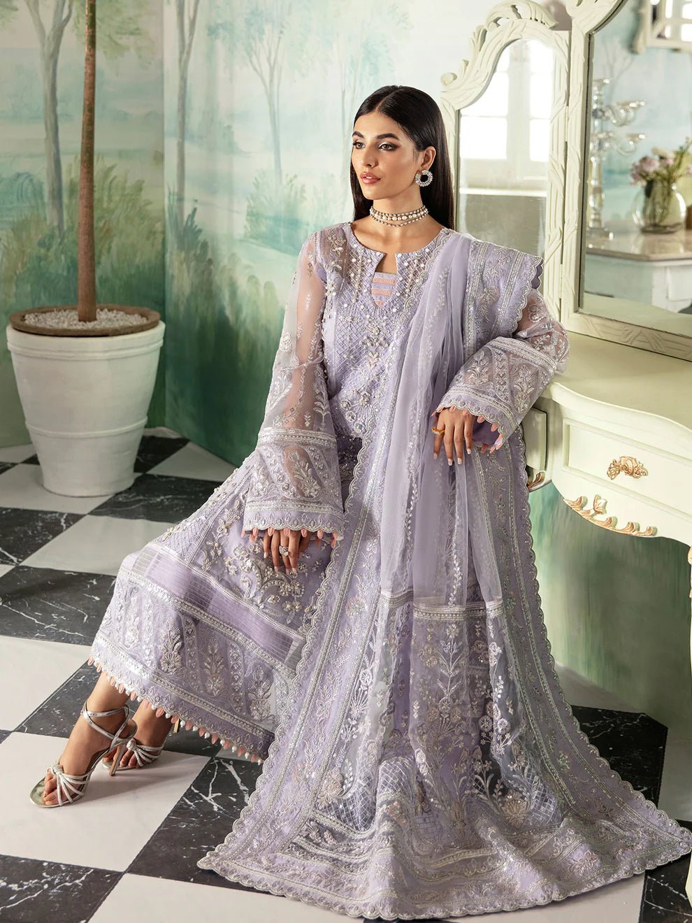 Model wearing a lavender Gulaal Liana GL - LP - V2 - 17 dress with intricate embroidery. Perfect for wedding occasions, highlighting Pakistani fashion online in the UK.