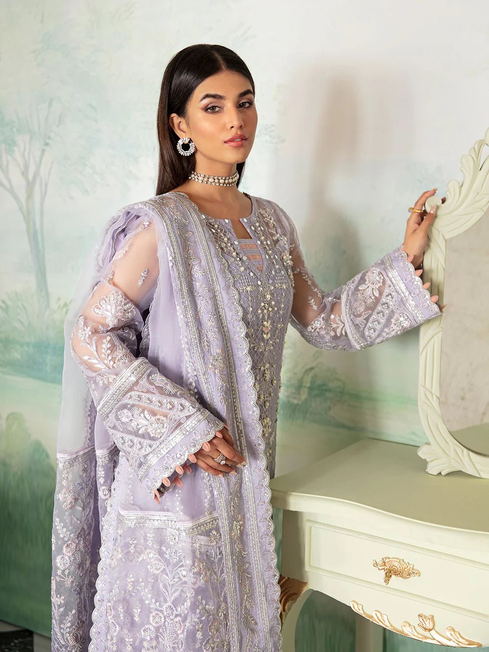 Model wearing a lavender Gulaal Liana GL - LP - V2 - 17 dress with intricate embroidery. Perfect for wedding occasions, highlighting Pakistani fashion online in the UK.