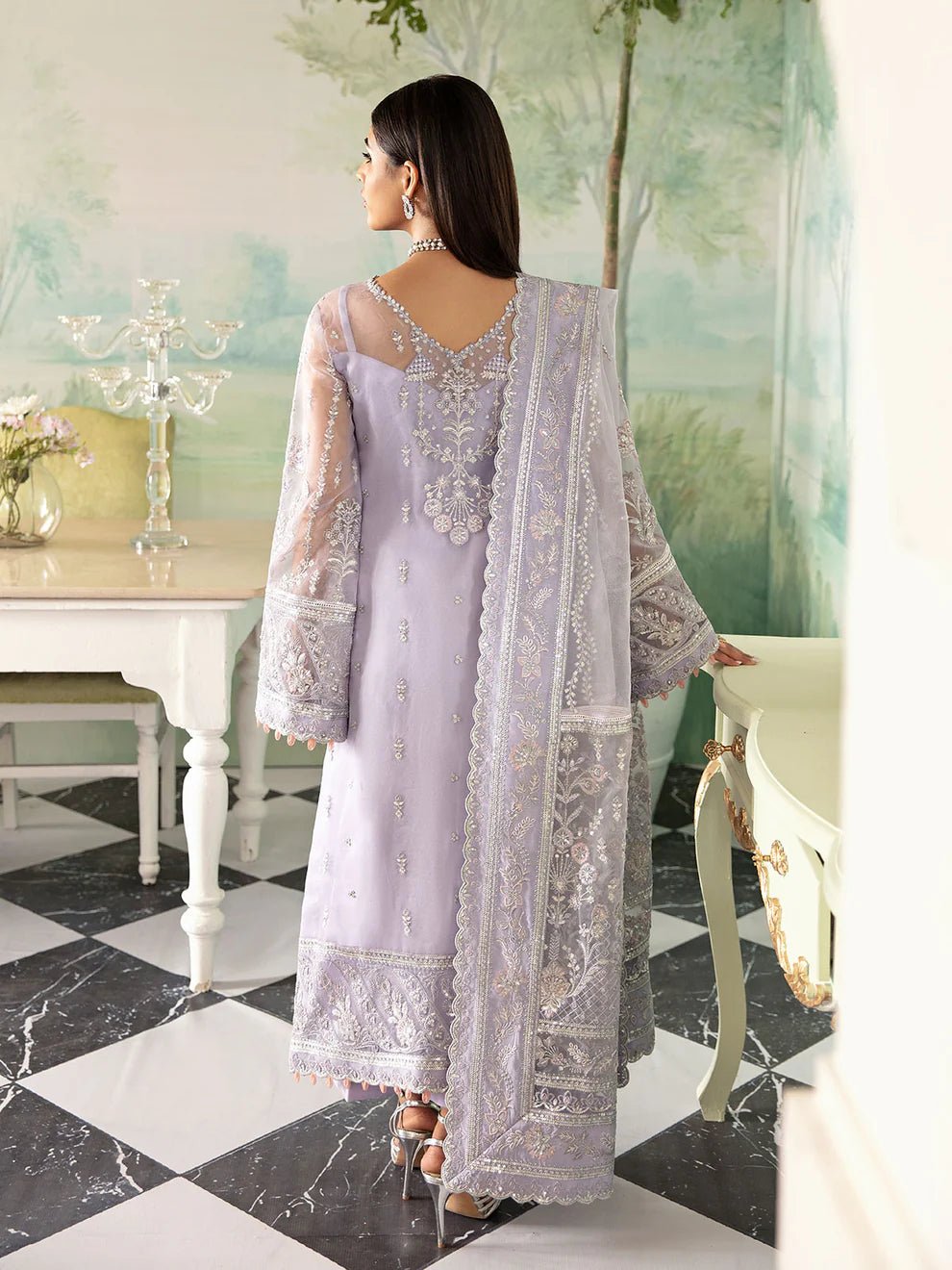 Model wearing a lavender Gulaal Liana GL - LP - V2 - 17 dress with intricate embroidery. Perfect for wedding occasions, highlighting Pakistani fashion online in the UK.