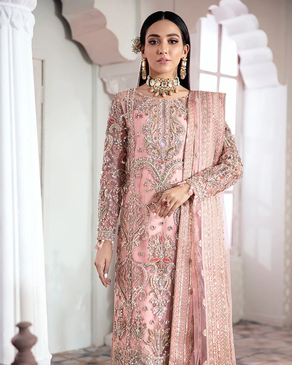 Model wearing a pink Arjumand Embroidered Net 3 - Piece Suit WS - 15 dress from Gulaal's Meherma Wedding Formals, showcasing Pakistani clothes online in the UK.