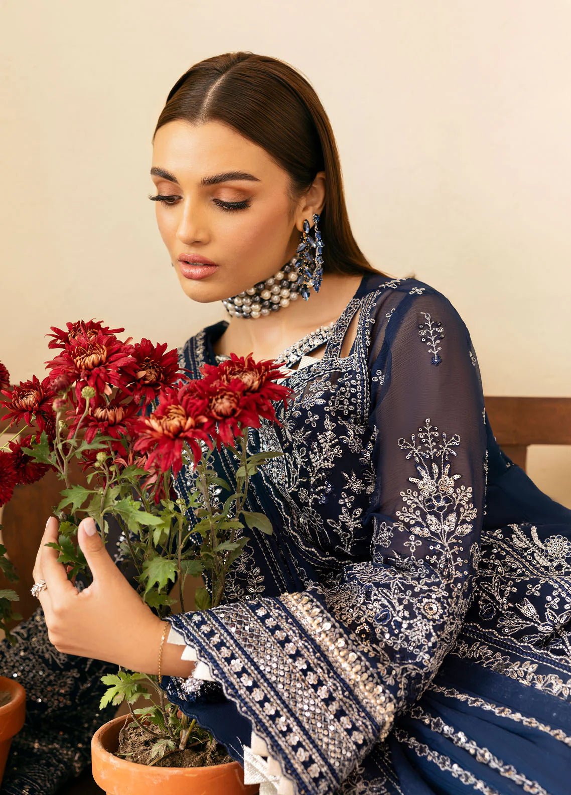 Model wearing Gulaal Arista midnight blue embroidered chiffon dress with intricate silver detailing and matching dupatta. Shop Pakistani clothes online in the UK now.