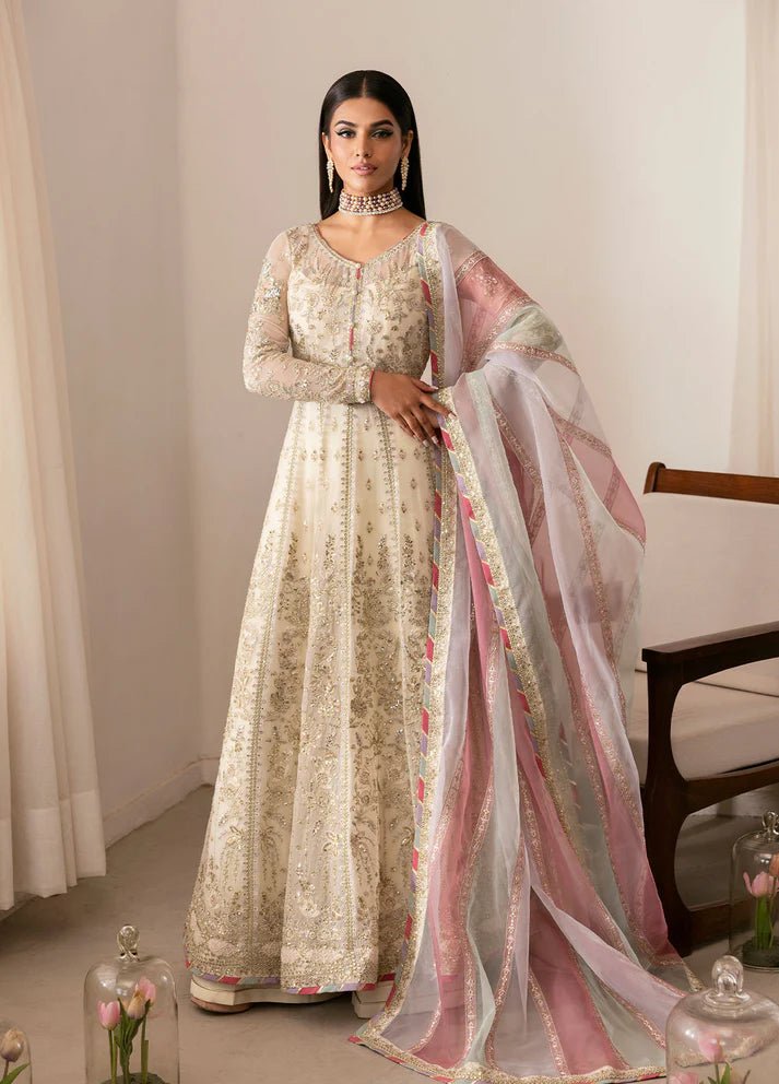 Model wearing Gulaal Chiragh ivory and pink embroidered chiffon dress with embellished dupatta. Shop Pakistani clothes online in the UK now.