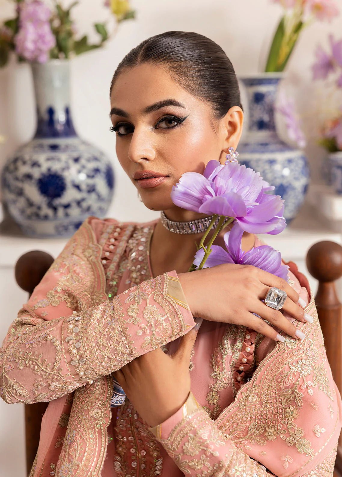 Model wearing Gulaal Coralyn blush pink embroidered chiffon dress with embellished dupatta. Shop Pakistani clothes online in the UK now.