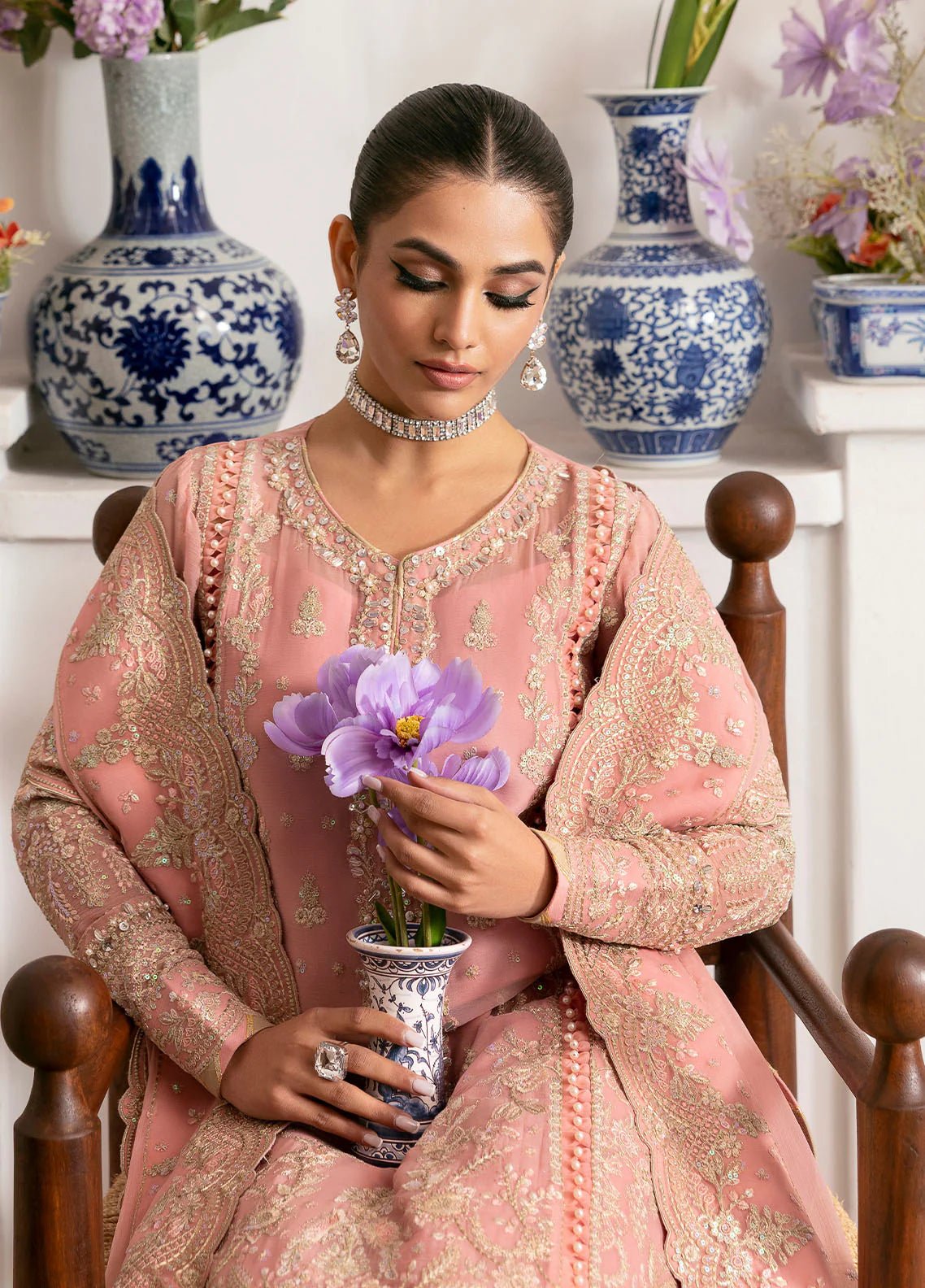 Model wearing Gulaal Coralyn blush pink embroidered chiffon dress with embellished dupatta. Shop Pakistani clothes online in the UK now.