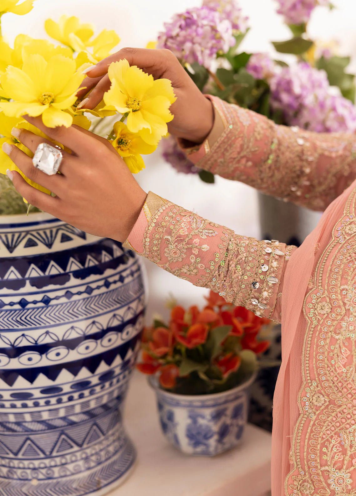 Model wearing Gulaal Coralyn blush pink embroidered chiffon dress with embellished dupatta. Shop Pakistani clothes online in the UK now.