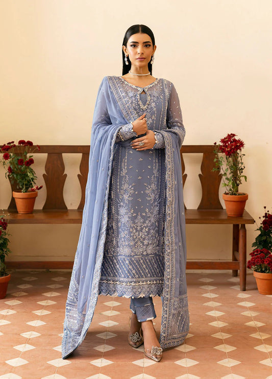 Model wearing Gulaal Meher periwinkle blue embroidered chiffon dress with intricate detailing and matching dupatta. Shop Pakistani clothes online in the UK now.