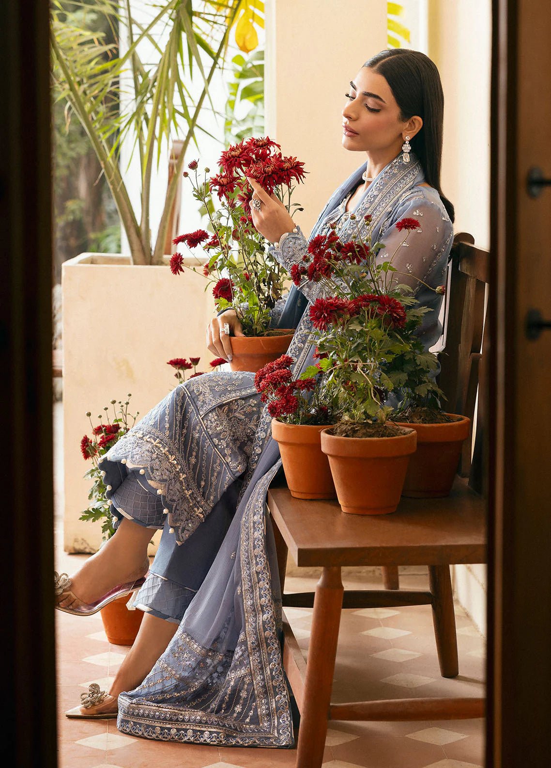 Model wearing Gulaal Meher periwinkle blue embroidered chiffon dress with intricate detailing and matching dupatta. Shop Pakistani clothes online in the UK now.