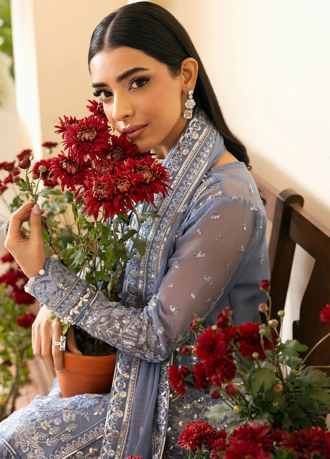 Model wearing Gulaal Meher periwinkle blue embroidered chiffon dress with intricate detailing and matching dupatta. Shop Pakistani clothes online in the UK now.