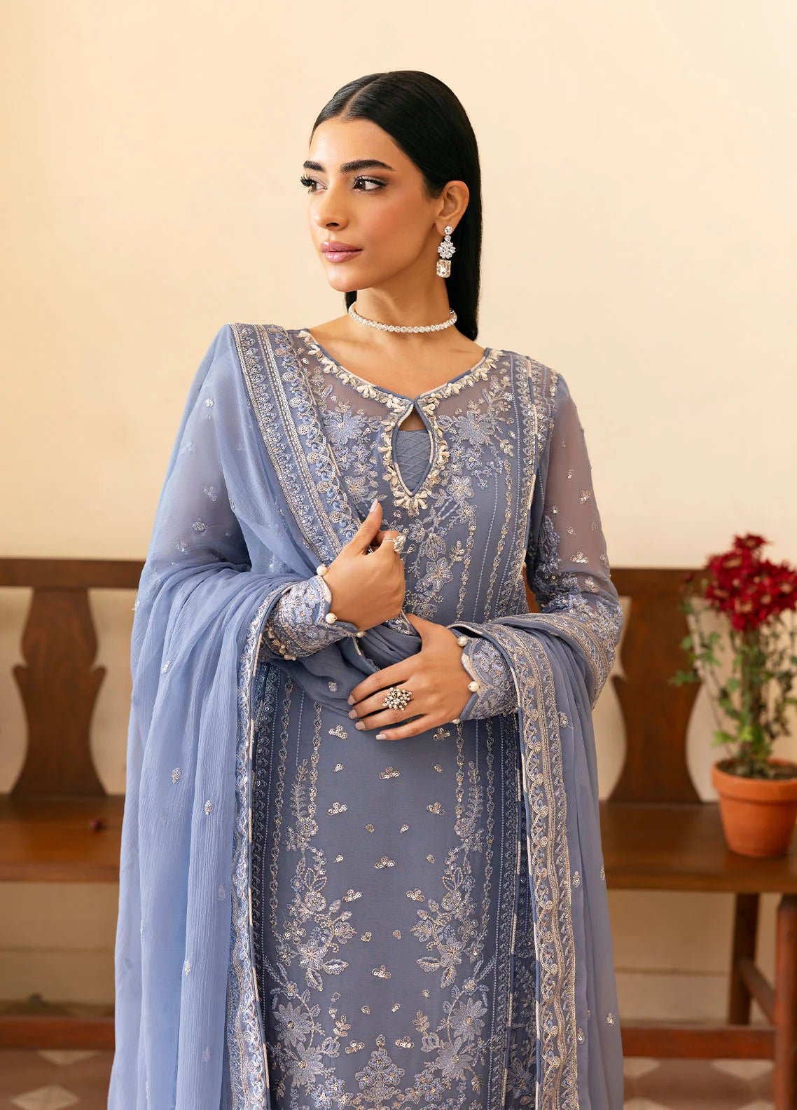 Model wearing Gulaal Meher periwinkle blue embroidered chiffon dress with intricate detailing and matching dupatta. Shop Pakistani clothes online in the UK now.