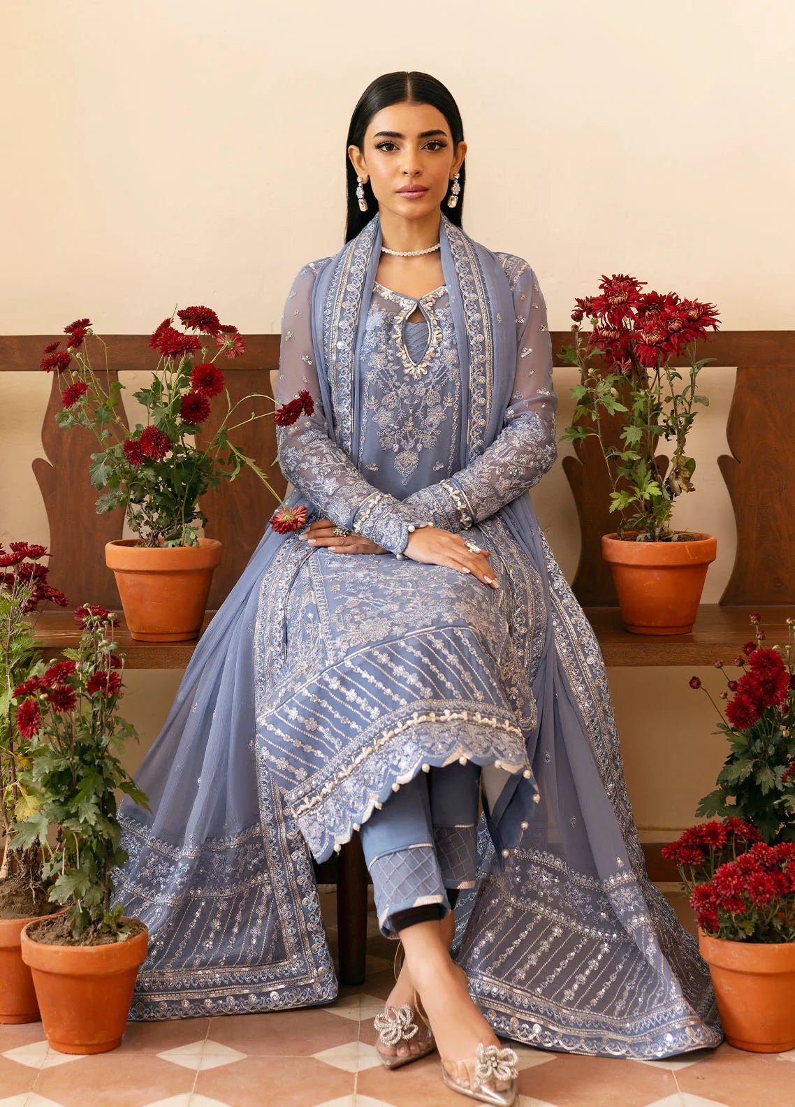 Model wearing Gulaal Meher periwinkle blue embroidered chiffon dress with intricate detailing and matching dupatta. Shop Pakistani clothes online in the UK now.