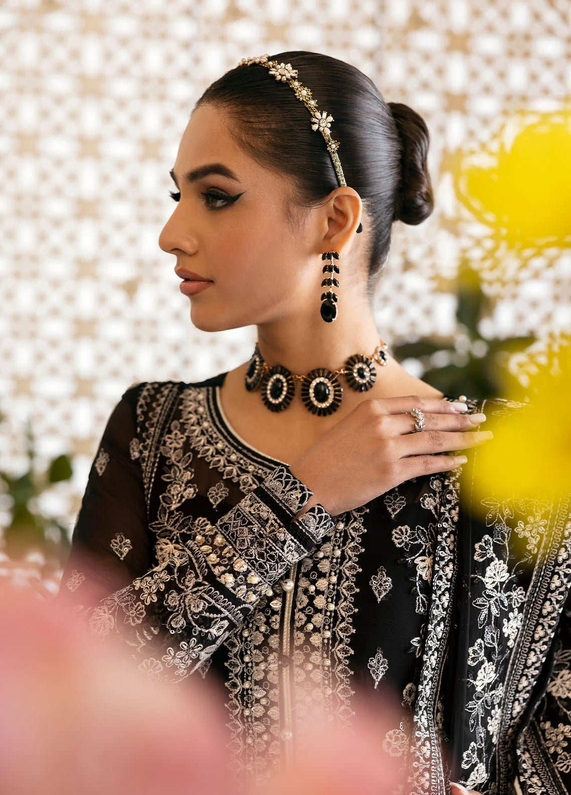 Model wearing Gulaal Nyra black embroidered chiffon dress with intricate silver detailing and dupatta. Shop Pakistani clothes online in the UK now.