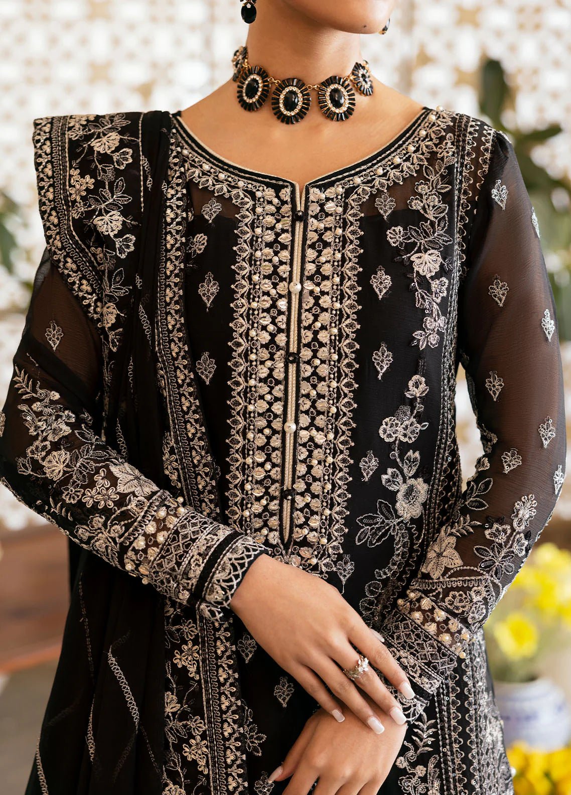 Model wearing Gulaal Nyra black embroidered chiffon dress with intricate silver detailing and dupatta. Shop Pakistani clothes online in the UK now.