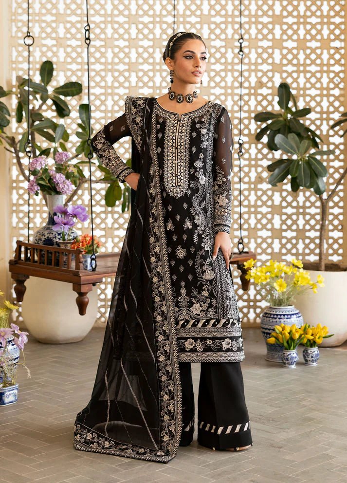 Model wearing Gulaal Nyra black embroidered chiffon dress with intricate silver detailing and dupatta. Shop Pakistani clothes online in the UK now.