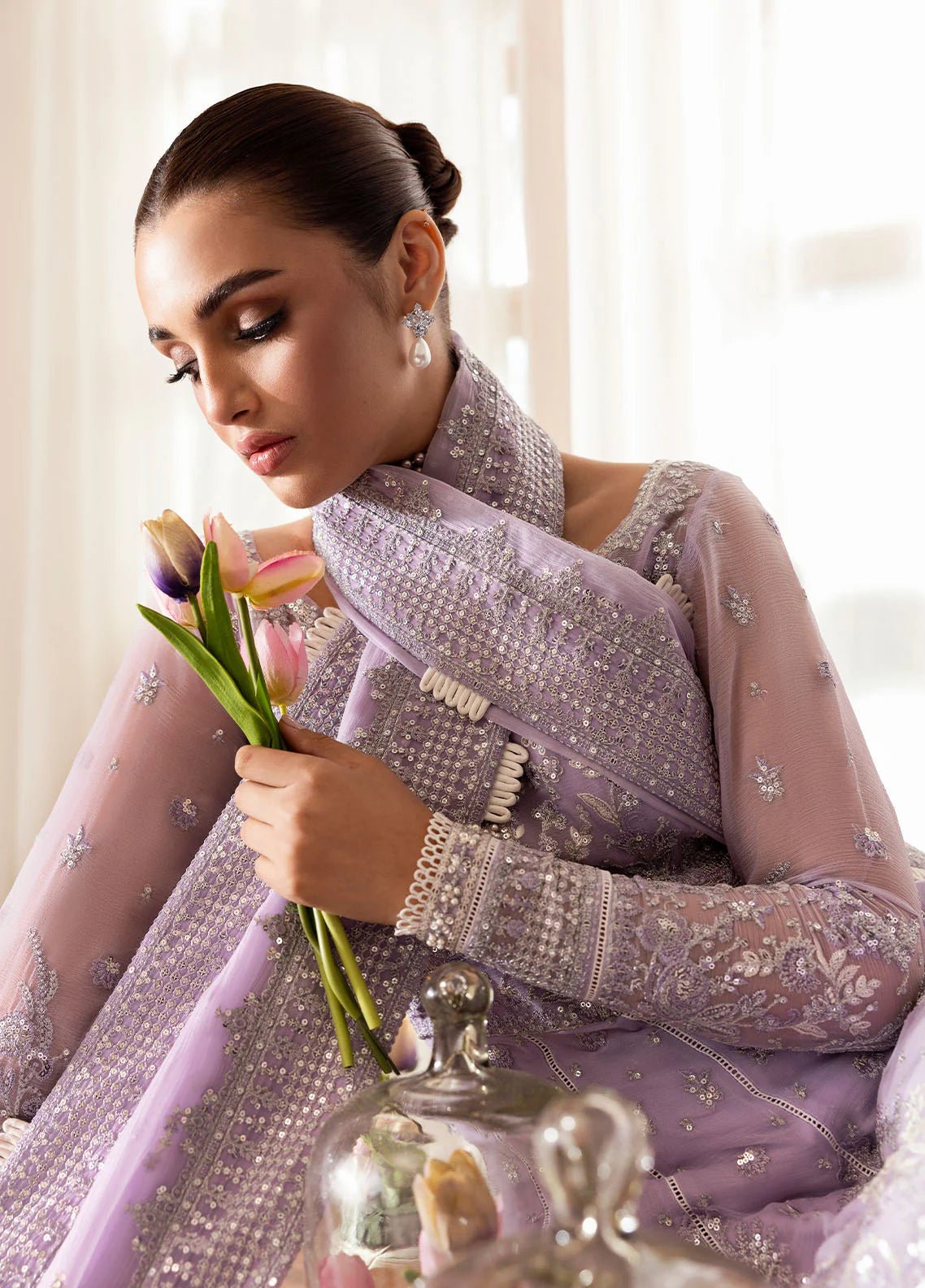 Model wearing Gulaal Pareesa pink lavender embroidered chiffon dress with embellished dupatta. Shop Pakistani clothes online in the UK now.