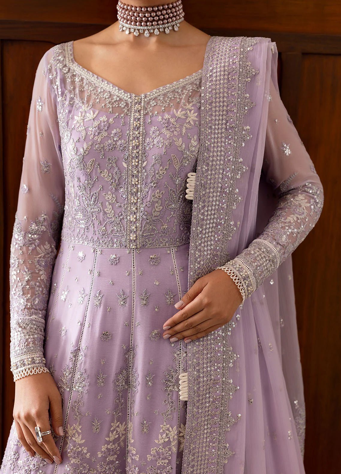 Model wearing Gulaal Pareesa pink lavender embroidered chiffon dress with embellished dupatta. Shop Pakistani clothes online in the UK now.