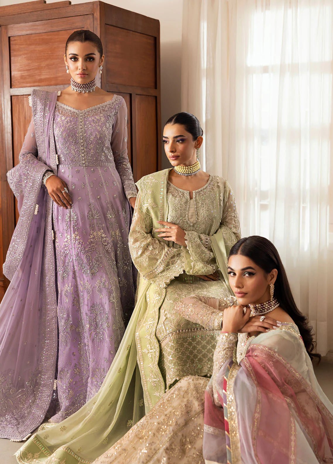 Model wearing Gulaal Virida pastel green embroidered chiffon dress with matching dupatta and trousers. Shop Pakistani clothes online in the UK now.