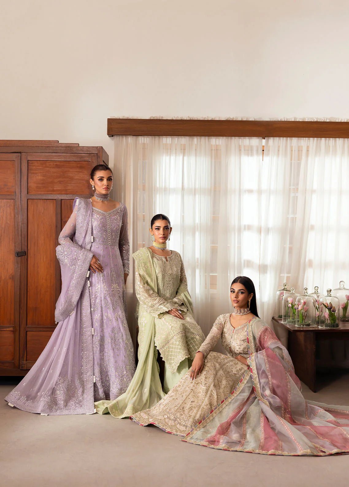 Model wearing Gulaal Virida pastel green embroidered chiffon dress with matching dupatta and trousers. Shop Pakistani clothes online in the UK now.