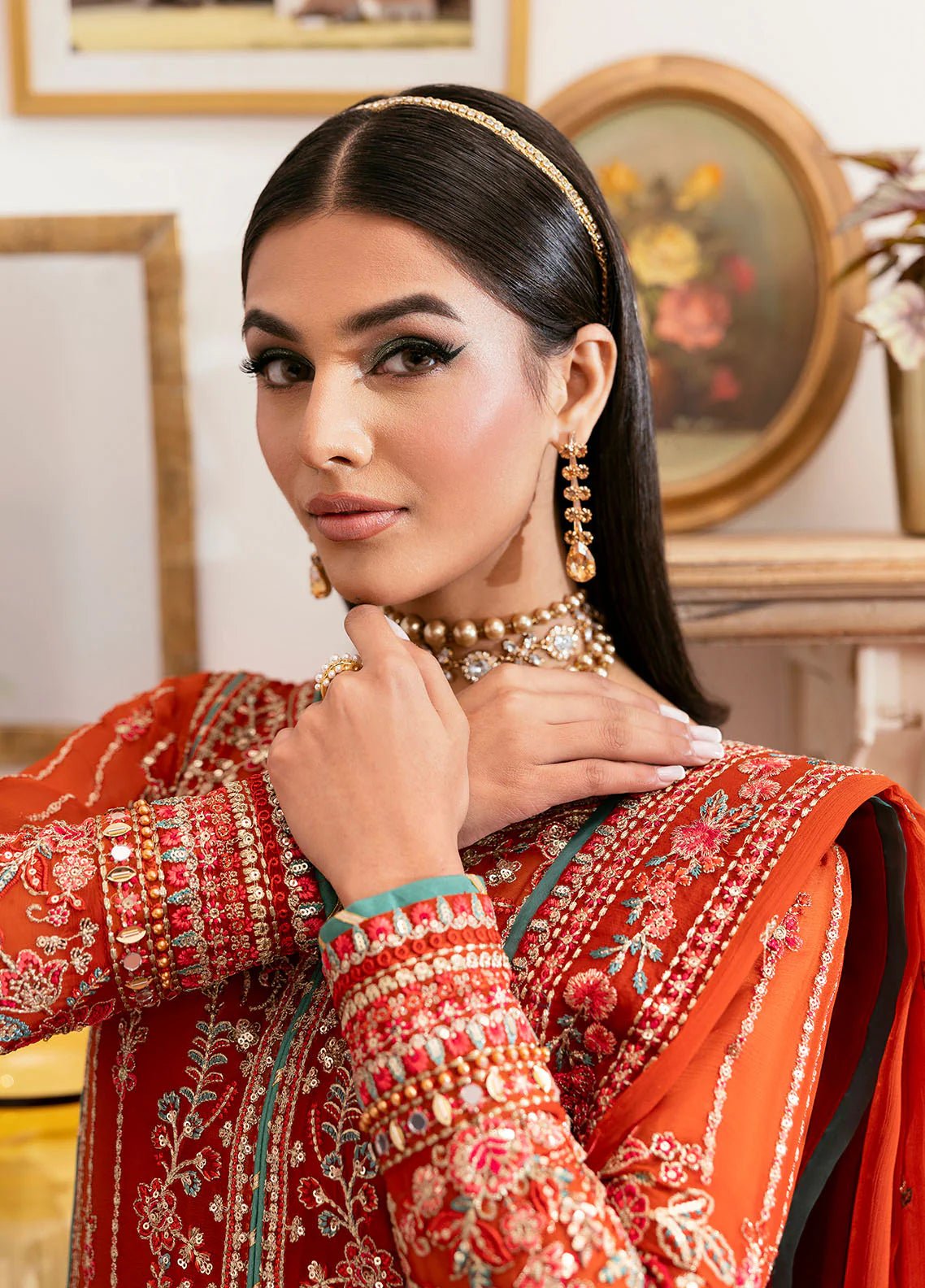 Model wearing Gulaal Zarna tiger lily embroidered chiffon dress with matching dupatta and trousers. Shop Pakistani clothes online in the UK now.