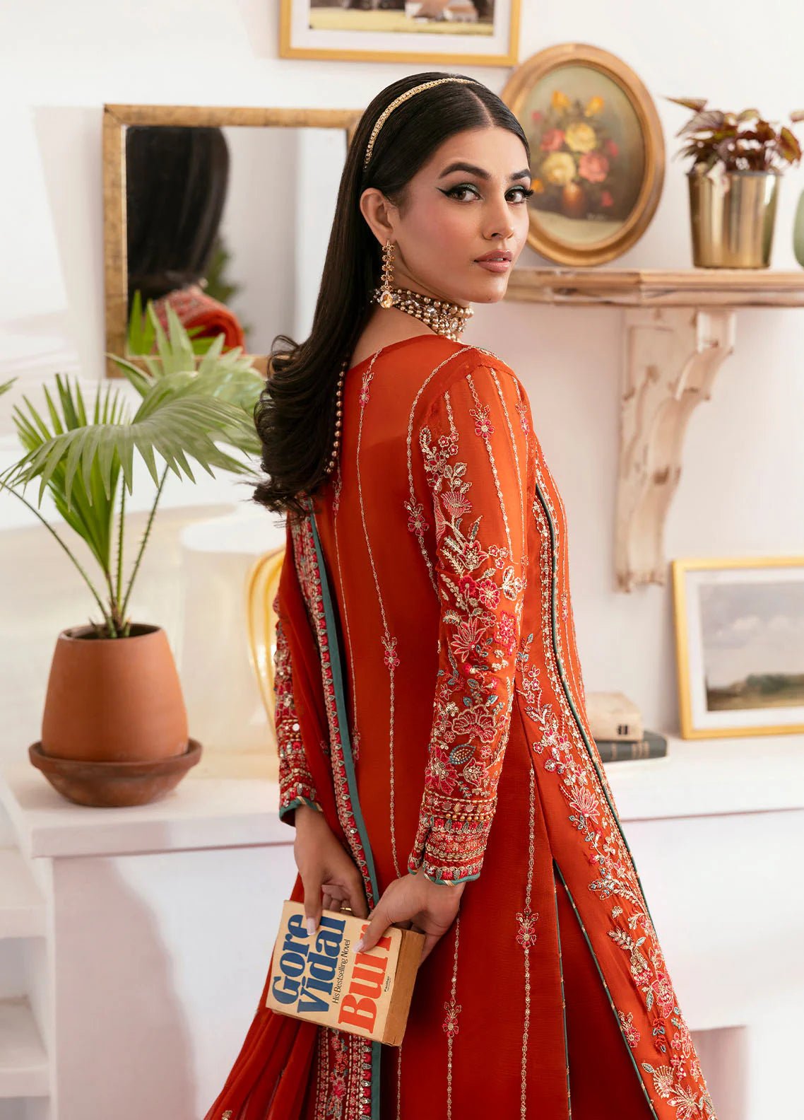 Model wearing Gulaal Zarna tiger lily embroidered chiffon dress with matching dupatta and trousers. Shop Pakistani clothes online in the UK now.