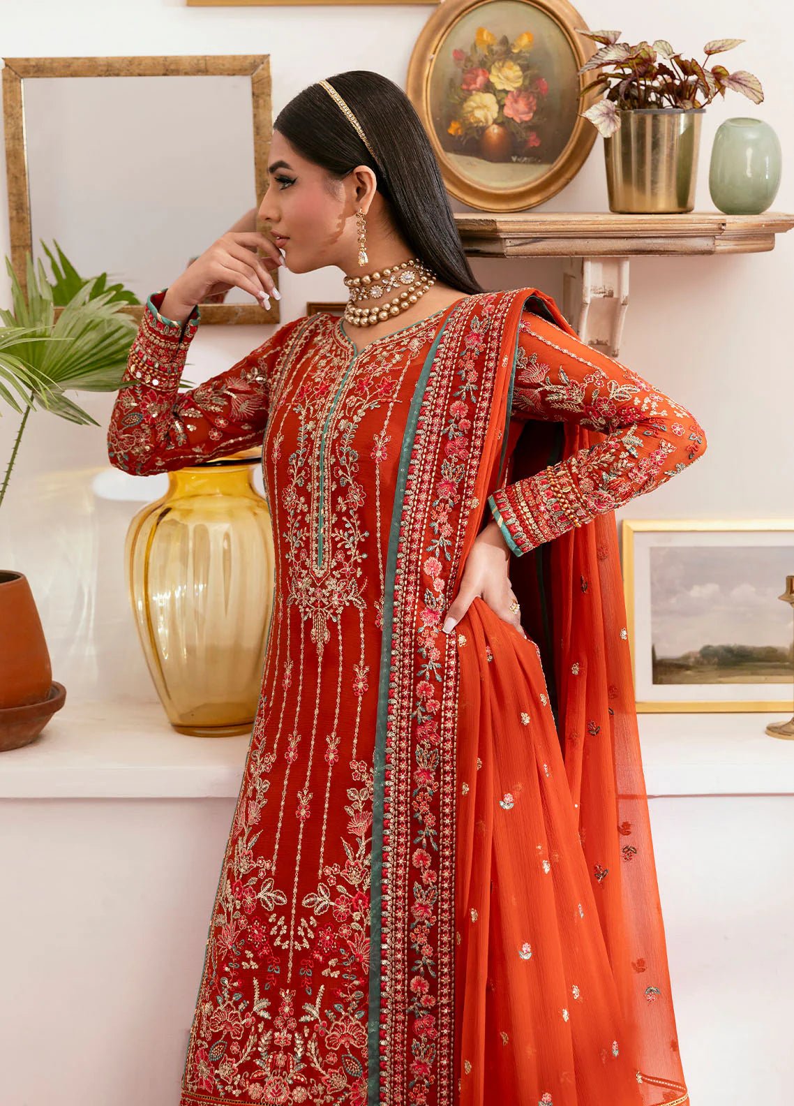 Model wearing Gulaal Zarna tiger lily embroidered chiffon dress with matching dupatta and trousers. Shop Pakistani clothes online in the UK now.