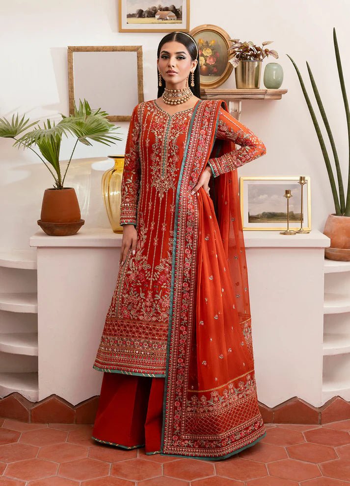 Model wearing Gulaal Zarna tiger lily embroidered chiffon dress with matching dupatta and trousers. Shop Pakistani clothes online in the UK now.