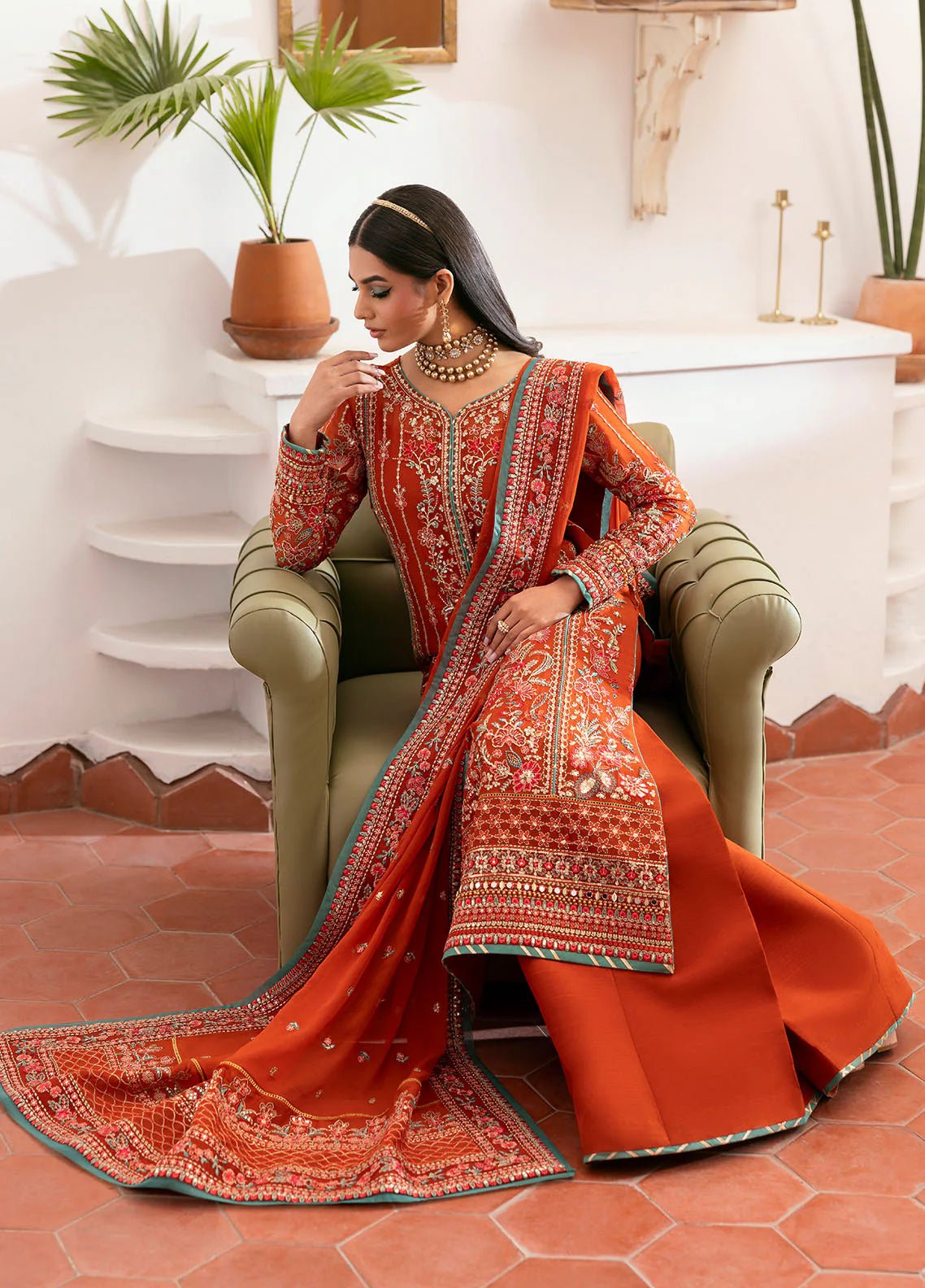 Model wearing Gulaal Zarna tiger lily embroidered chiffon dress with matching dupatta and trousers. Shop Pakistani clothes online in the UK now.