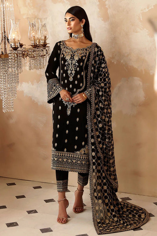 Model wearing a black Gulaal Shehrnaaz Raw Silk outfit with intricate embroidery and sequins, paired with an embroidered chiffon dupatta and dyed silk trousers, perfect for festive occasions.