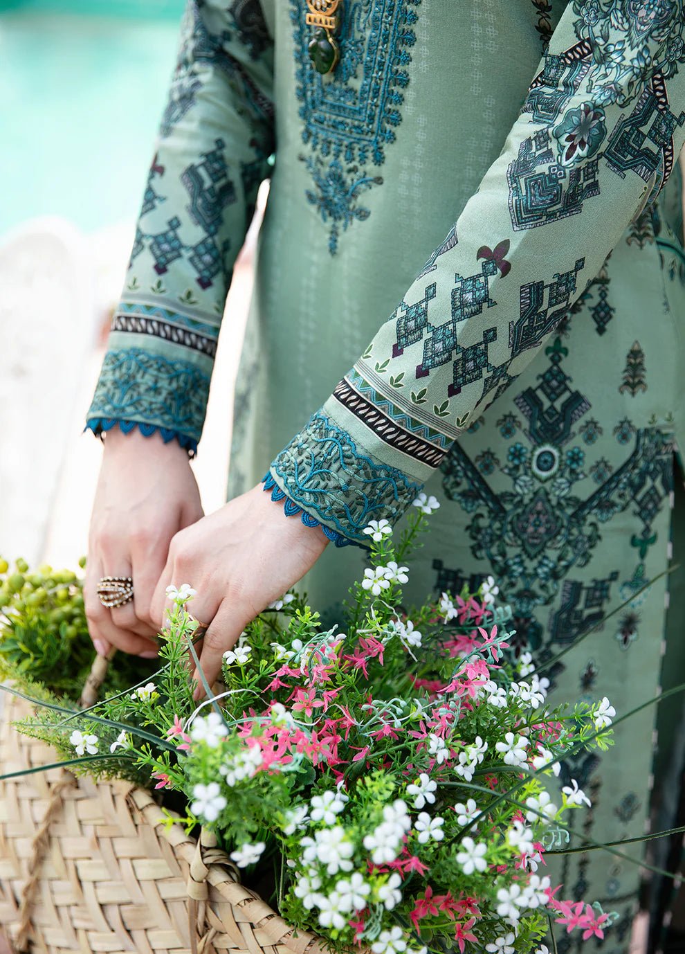 Model wearing the ANADIYA teal dress from Gulaal, elegantly highlighting Pakistani fashion online in the UK.