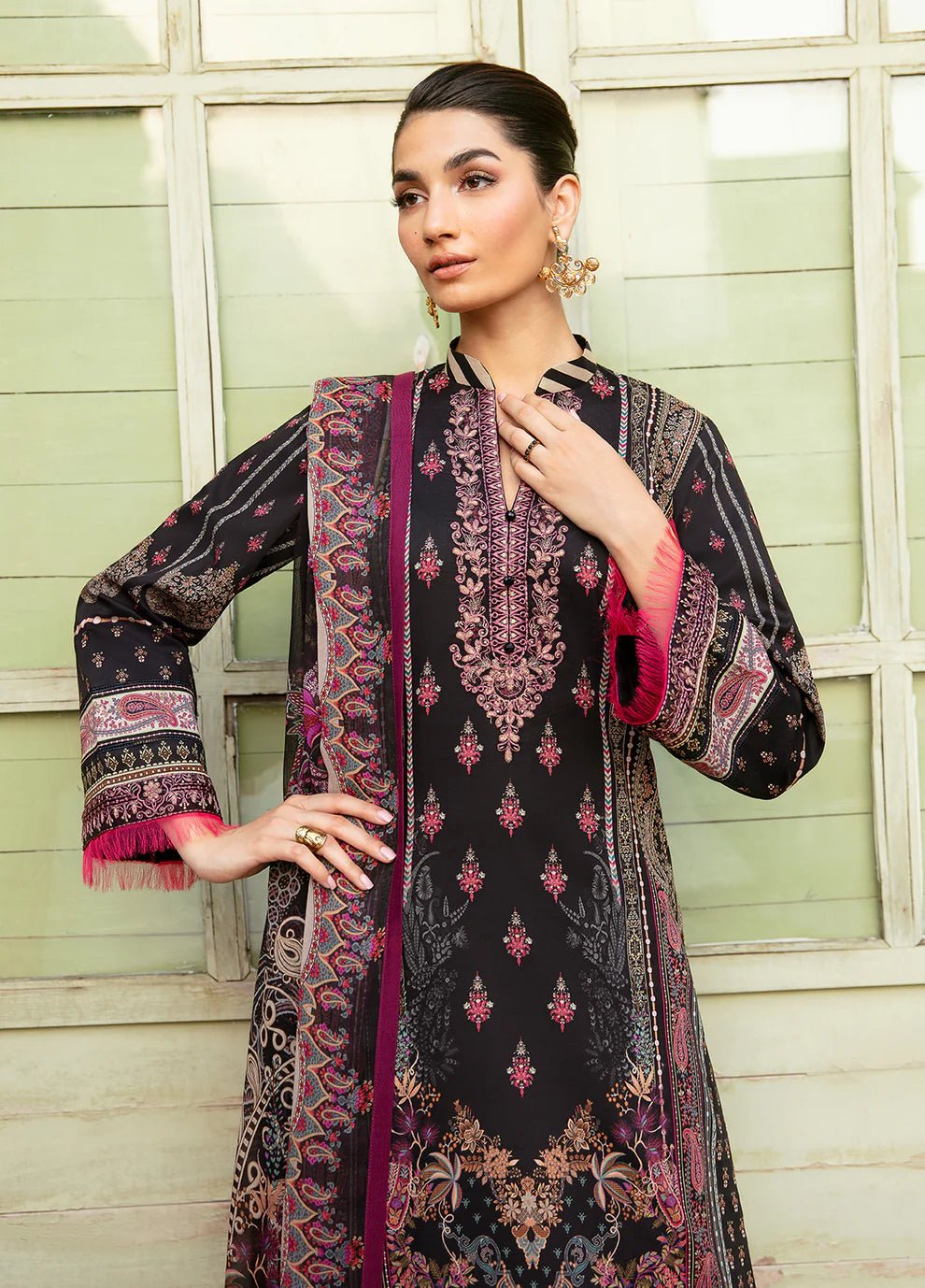 Model wearing the ANDREA black floral dress from Gulaal, showcasing elegant Pakistani fashion online in the UK.