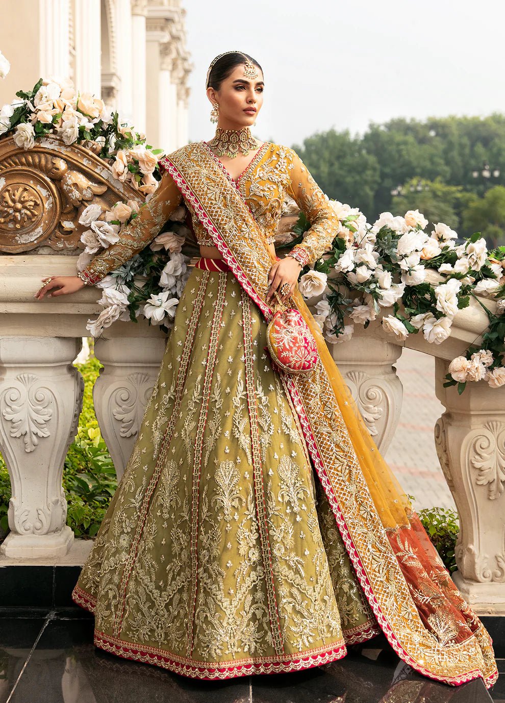 Model wearing Gulaal Luxury Lawn Diya GL - WU - 23V1 - 01 dress in green, mustard, and coral, Pakistani clothes online in UK.