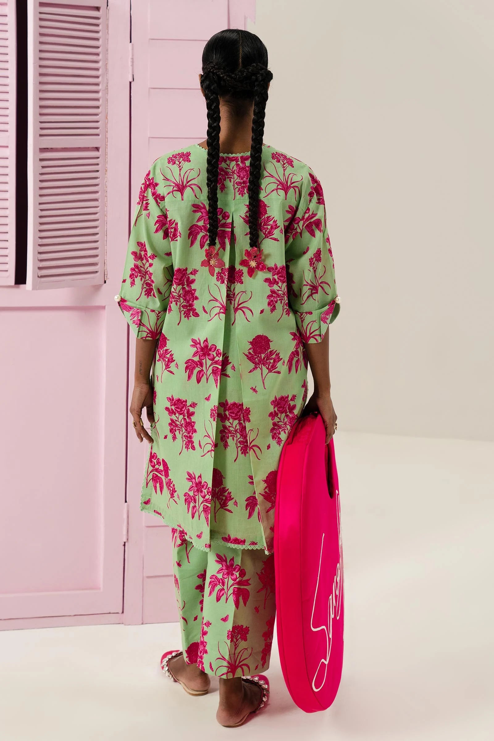 Model wearing Sana Safinaz Mahay'24 green lawn dress with pink florals, chic Pakistani summer fashion in UK.