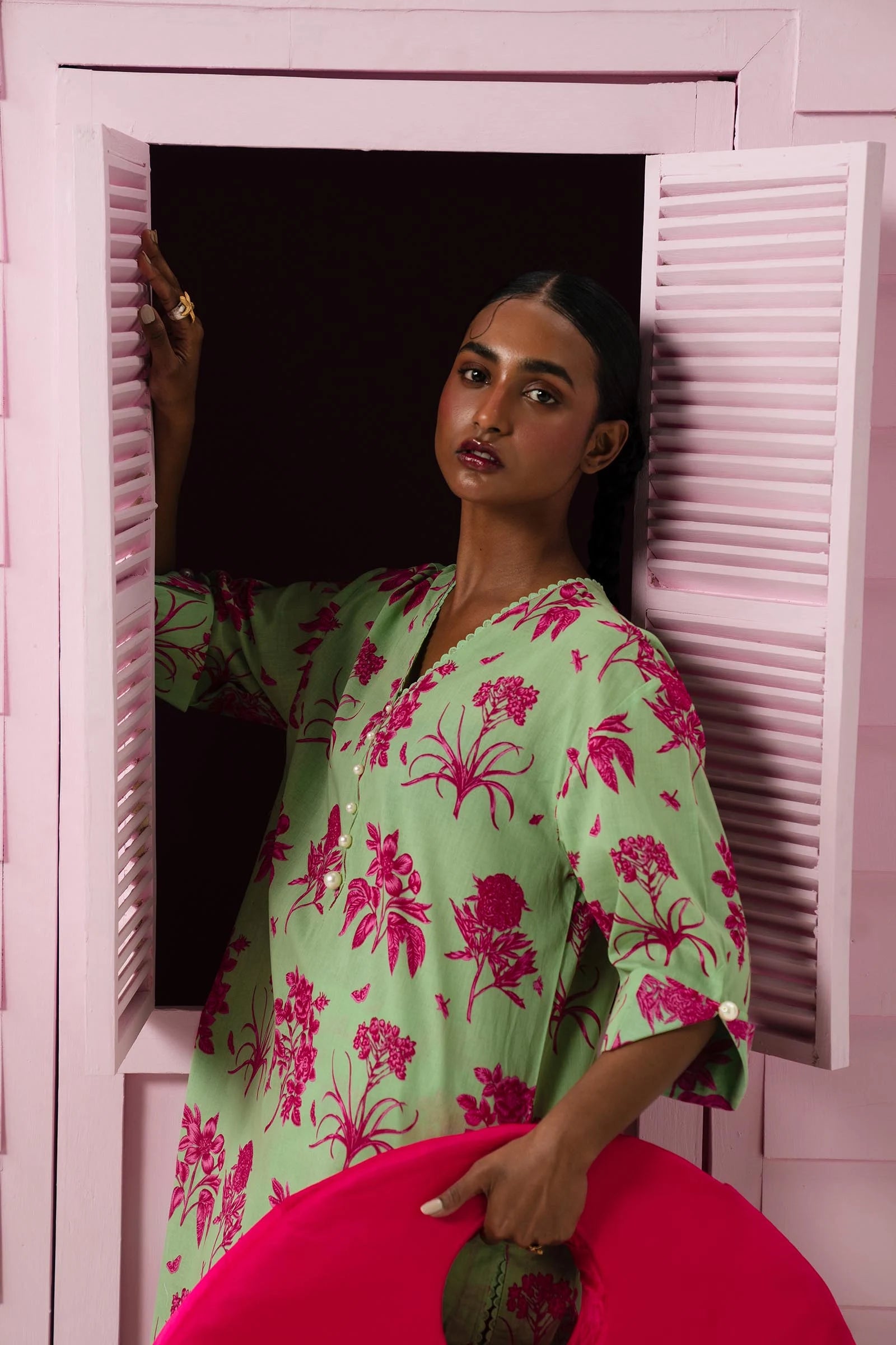 Model wearing Sana Safinaz Mahay'24 green lawn dress with pink florals, chic Pakistani summer fashion in UK.