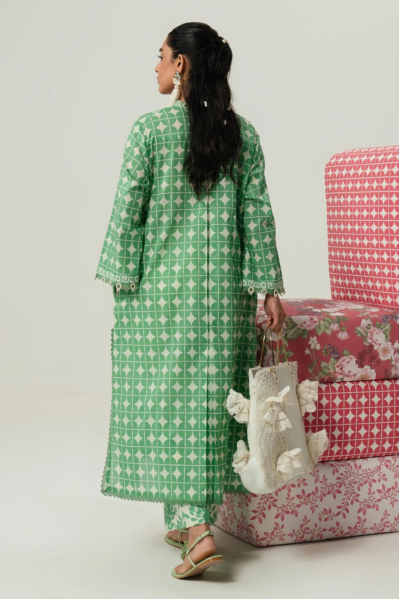 Model wearing Sana Safinaz Mahay'24 green geometric pattern lawn suit, fresh pakistani designer wear in UK.