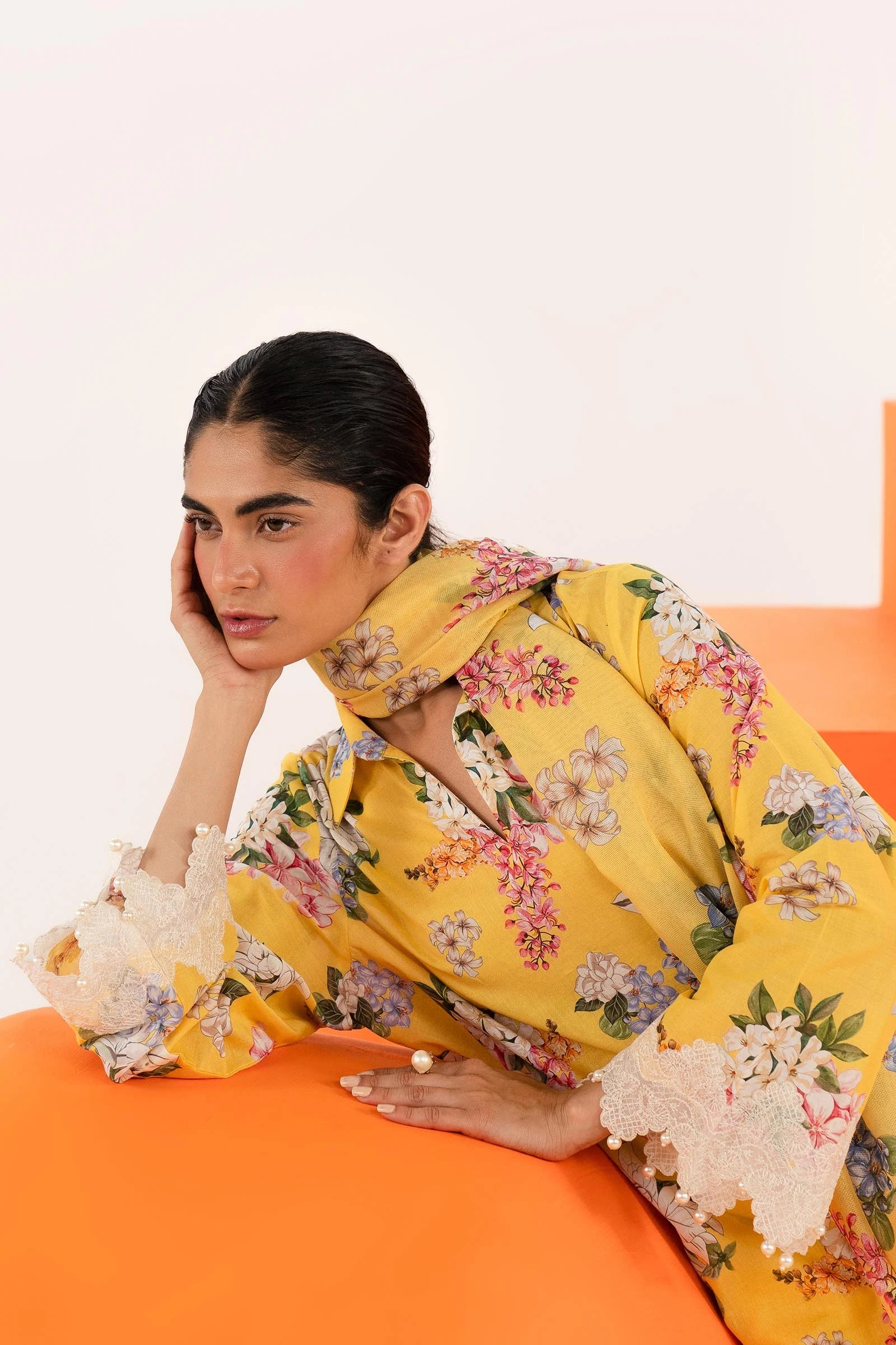 Model wearing Sana Safinaz Mahay'24 yellow floral lawn suit, bright summer outfit in UK.